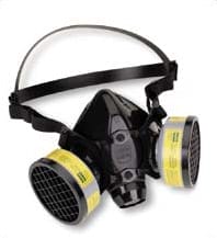 Black industrial respirator mask with dual yellow filters, symbolizing worker safety equipment tied to liability in Macias v. Saberhagen Holdings.