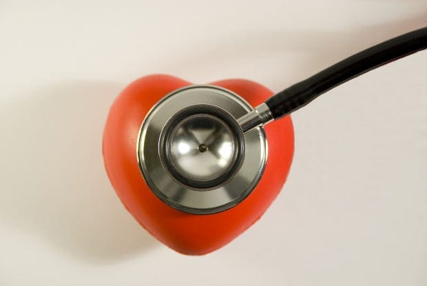 A stethoscope placed on a red heart, symbolizing medical risks linked to IVC blood clot filters and their safety concerns.
